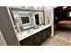 Bright bathroom features double sinks, quartz countertops, modern fixtures and large mirror at 81 Richmond Way, Villa Rica, GA 30180