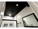 Bathroom showcasing a black ceiling, a framed glass shower, and a black framed mirror at 81 Richmond Way, Villa Rica, GA 30180