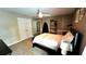 Cozy bedroom with neutral carpeting, ceiling fan, and well-lit windows and doors at 81 Richmond Way, Villa Rica, GA 30180
