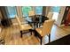 Cozy breakfast nook features a black round table with seating for four and views of the outdoors at 81 Richmond Way, Villa Rica, GA 30180