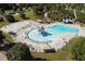 An aerial view of the Gathering-friendly community pool with ample seating, slides, and a water play area at 81 Richmond Way, Villa Rica, GA 30180