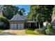 Charming brick home with a two-car garage and well-manicured front yard at 81 Richmond Way, Villa Rica, GA 30180