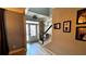 Bright foyer with a white front door, light wood floors, and stairwell at 81 Richmond Way, Villa Rica, GA 30180