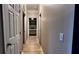 Hallway with wood floors and neutral walls, leading to various rooms in the home at 81 Richmond Way, Villa Rica, GA 30180