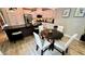 Eat-in kitchen featuring sleek black counters, stainless appliances, and light wood flooring at 81 Richmond Way, Villa Rica, GA 30180