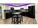Modern kitchen featuring updated appliances, two-tone cabinetry, and a stylish island at 81 Richmond Way, Villa Rica, GA 30180