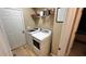 Convenient laundry room equipped with modern washer, dryer, storage, and shelving units at 81 Richmond Way, Villa Rica, GA 30180