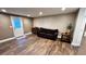 Inviting living room featuring hard surface floors, ample space and recessed lighting at 81 Richmond Way, Villa Rica, GA 30180