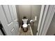 Small powder room with neutral walls and tile floors at 81 Richmond Way, Villa Rica, GA 30180