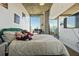 Bedroom features large windows with city views, providing ample natural light and concrete ceilings at 860 Peachtree Ne St # 1511, Atlanta, GA 30308