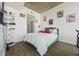 Comfortable bedroom with wood floors, unique decor, and ample lighting at 860 Peachtree Ne St # 1511, Atlanta, GA 30308