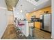 Modern kitchen with stainless steel appliances, bar seating, and wood floors at 860 Peachtree Ne St # 1511, Atlanta, GA 30308