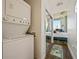 Stackable washer and dryer are conveniently located near a mirrored closet that reflects light into the bedroom at 860 Peachtree Ne St # 1511, Atlanta, GA 30308