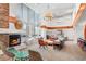 Inviting lounge area with comfortable seating, a fireplace, and large windows offering city views at 860 Peachtree Ne St # 1511, Atlanta, GA 30308