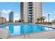 Large rooftop pool with city views, complete with lounge chairs and landscaping, offers a luxurious outdoor space at 860 Peachtree Ne St # 1511, Atlanta, GA 30308