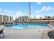 Large community pool boasts plenty of lounge chairs and umbrellas, and impressive views of the surrounding buildings at 860 Peachtree Ne St # 1511, Atlanta, GA 30308