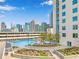 Rooftop pool and lounge area overlook the city skyline, offering a refreshing amenity with views at 860 Peachtree Ne St # 1511, Atlanta, GA 30308