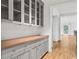 Convenient butler's pantry with custom cabinetry, countertop space and seamless access to other rooms at 98 Sheridan Dr, Atlanta, GA 30305