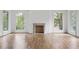 Bright living room with hardwood floors, fireplace, and large windows that bring in natural light at 98 Sheridan Dr, Atlanta, GA 30305