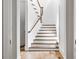 Bright staircase features white risers and stained treads at 98 Sheridan Dr, Atlanta, GA 30305