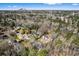 Sweeping aerial view showcasing a home nestled among trees, offering a serene setting, with mountains in the distance at 5017 Tanaga Ct, Stone Mountain, GA 30087