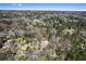 A high angle view shows a home nestled within a neighborhood, surrounded by trees, offering a tranquil and private setting at 5017 Tanaga Ct, Stone Mountain, GA 30087