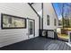 Home's back deck featuring painted wood, black trim, and access to backyard at 5017 Tanaga Ct, Stone Mountain, GA 30087