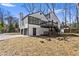 Lovely backyard featuring a deck, garage, and ample space for outdoor activities on a sunny day at 5017 Tanaga Ct, Stone Mountain, GA 30087