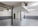 Unfinished basement features high ceilings, concrete floors, and garage door access at 5017 Tanaga Ct, Stone Mountain, GA 30087