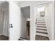 Stairwell features direct access to the basement and stairs leading to the main floor at 5017 Tanaga Ct, Stone Mountain, GA 30087