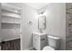 Charming bathroom with updated vanity, fixtures, and a tiled shower featuring marble pattern at 5017 Tanaga Ct, Stone Mountain, GA 30087