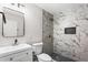 Bathroom with marble-look tiled shower and modern fixtures at 5017 Tanaga Ct, Stone Mountain, GA 30087