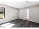 Bedroom featuring gray flooring, recessed lighting, and a window with natural light at 5017 Tanaga Ct, Stone Mountain, GA 30087