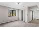 Bedroom featuring neutral carpet, a window, and a closet at 5017 Tanaga Ct, Stone Mountain, GA 30087