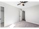 Bedroom with a ceiling fan, carpet floors, and a closet at 5017 Tanaga Ct, Stone Mountain, GA 30087