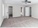 Spacious bedroom with neutral carpet and access to walk-in closet and attached bathroom at 5017 Tanaga Ct, Stone Mountain, GA 30087