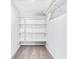 Walk-in closet featuring built-in shelving to maximize storage and organization at 5017 Tanaga Ct, Stone Mountain, GA 30087