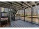 Outdoor deck featuring covered lounge area with access to backyard at 5017 Tanaga Ct, Stone Mountain, GA 30087