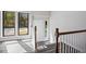 Bright foyer with wood-look flooring, stairs to upper level and exterior views at 5017 Tanaga Ct, Stone Mountain, GA 30087