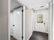 Hallway with gray floors featuring an exterior door and closet at 5017 Tanaga Ct, Stone Mountain, GA 30087
