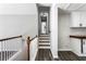Hallway with hardwood floors and white trim, leading to the bedrooms at 5017 Tanaga Ct, Stone Mountain, GA 30087