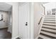 Bright hallway with staircase featuring white risers and wood treads plus gray flooring at 5017 Tanaga Ct, Stone Mountain, GA 30087