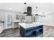 Bright kitchen featuring a large island, stainless steel appliances, and a view of the outdoors at 5017 Tanaga Ct, Stone Mountain, GA 30087