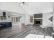 Open concept living room has vaulted ceiling, fireplace and adjoins kitchen at 5017 Tanaga Ct, Stone Mountain, GA 30087