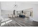 Open concept living and kitchen area with wood-look floors and modern fixtures at 5017 Tanaga Ct, Stone Mountain, GA 30087