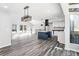 Open-concept living space with hardwood floors, high ceilings, and abundant natural light at 5017 Tanaga Ct, Stone Mountain, GA 30087