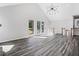 Light and bright living room features a vaulted ceiling and large windows at 5017 Tanaga Ct, Stone Mountain, GA 30087
