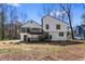 Rear exterior featuring a white paint scheme, black trim, and multiple decks at 5017 Tanaga Ct, Stone Mountain, GA 30087
