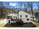 Rear exterior featuring a white paint scheme, black trim, and multiple decks at 5017 Tanaga Ct, Stone Mountain, GA 30087