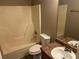 Cozy bathroom with shower-tub combo and tiled floors at 5942 King Way Walk, Lithonia, GA 30058